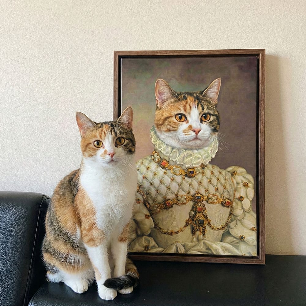 Cat sitting next to a framed portrait of a cat in regal attire.