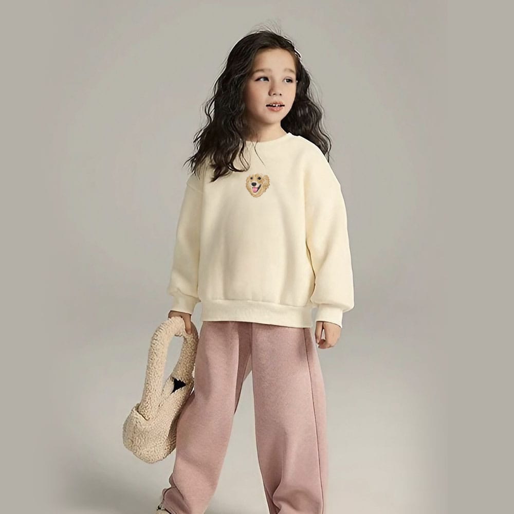 A custom cream embroidered pet portrait sweatshirt designed for kids.