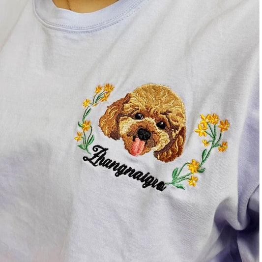 A custom pet memorial embroidered crewneck sweatshirt, featuring a pet portrait and memorial text.