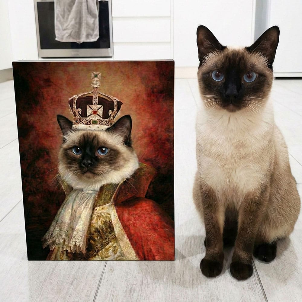 Siamese cat next to a painting of a cat wearing a crown and robe