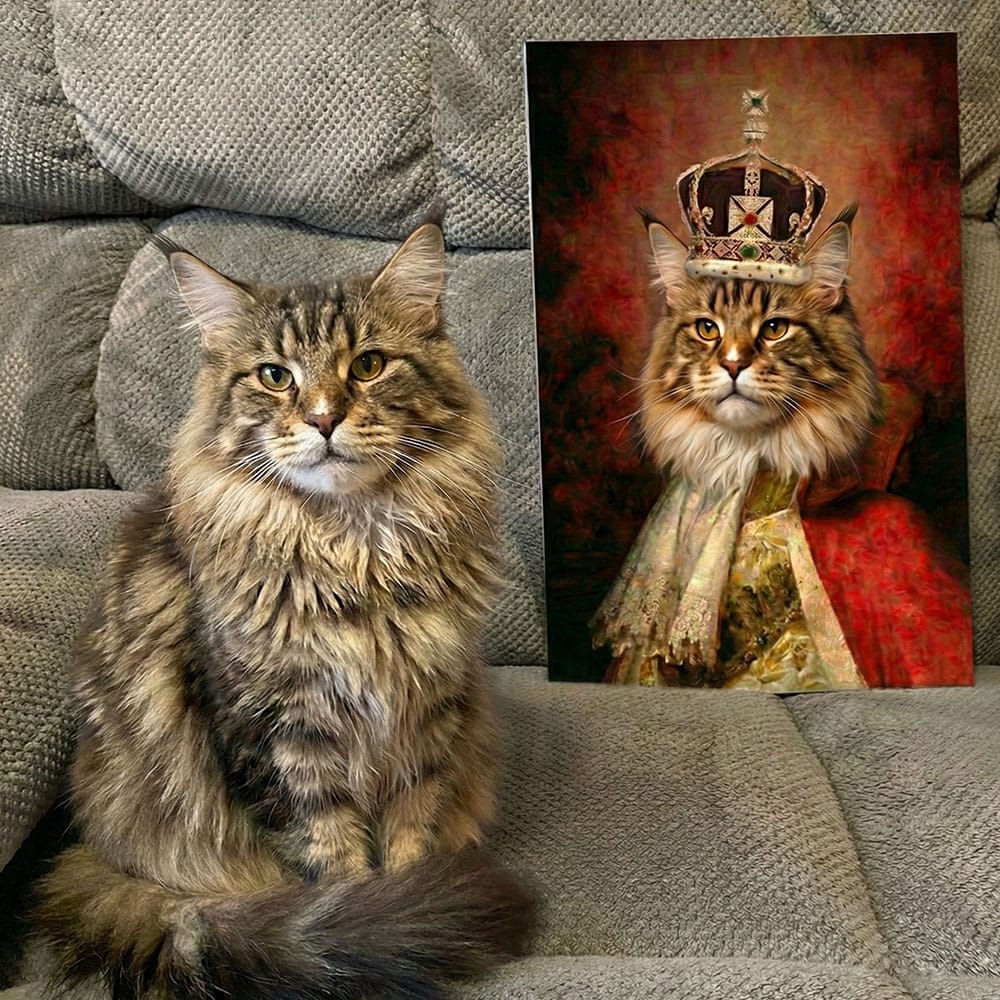 Realistic cat sitting on a couch next to a painting of a cat wearing a crown.