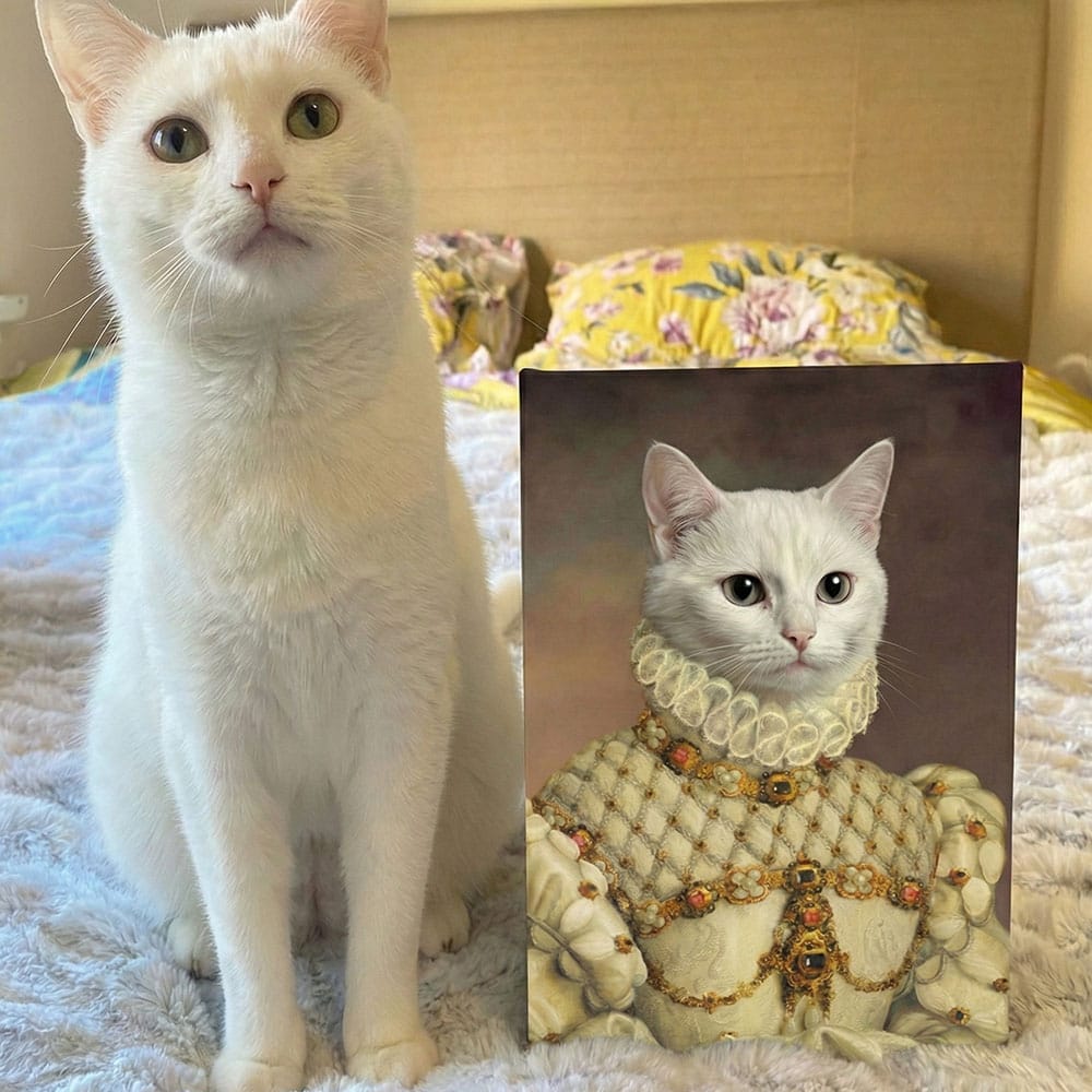 White cat next to a portrait of a cat in regal attire
