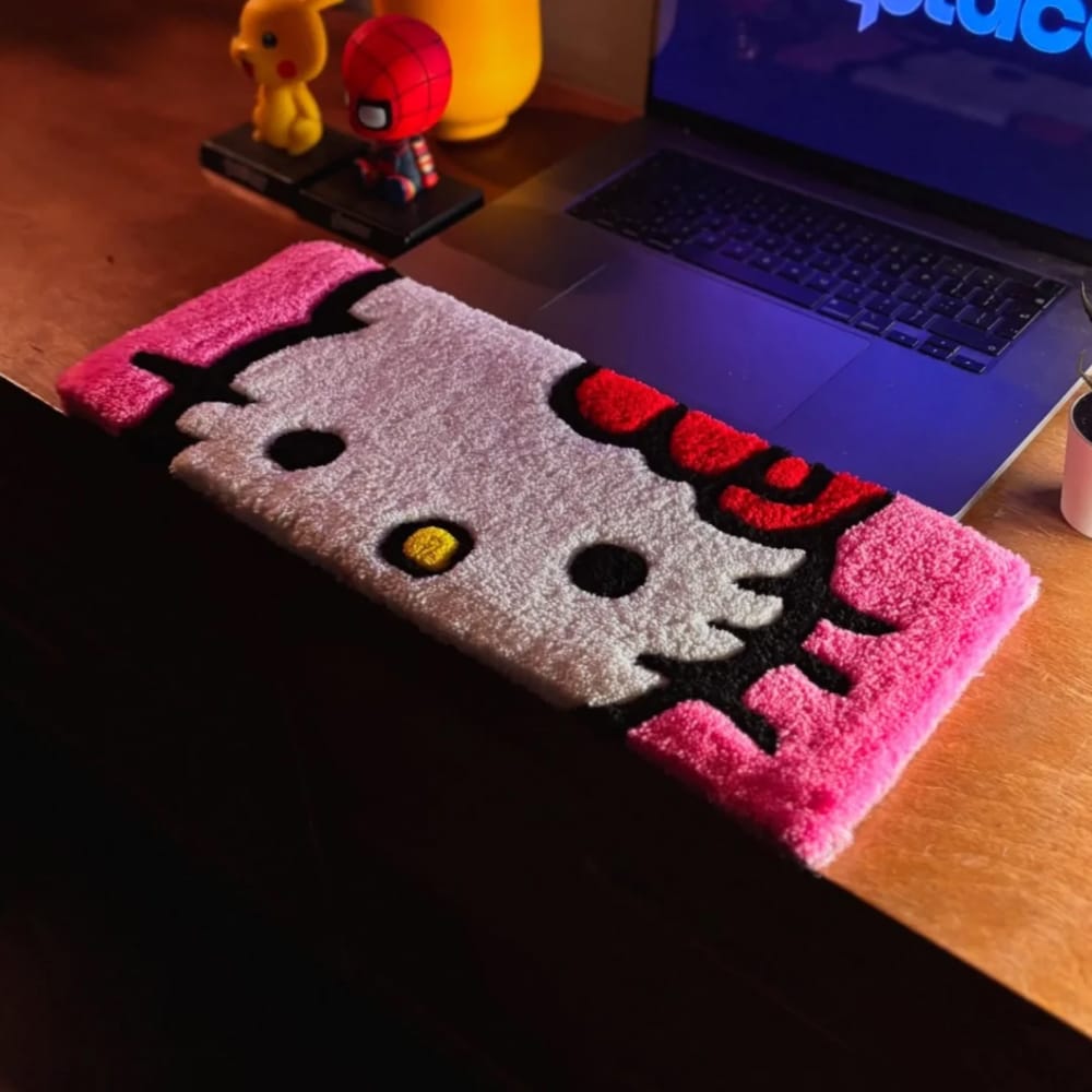 Artisan custom tufted keyboard rugs displayed as unique cartoon-style desk accessories.