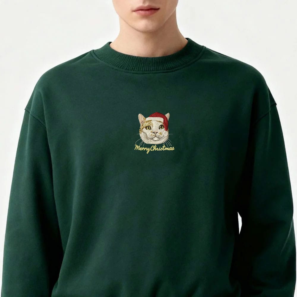 Green custom embroidered pet portrait Christmas sweatshirt featuring a cat wearing a Santa hat.