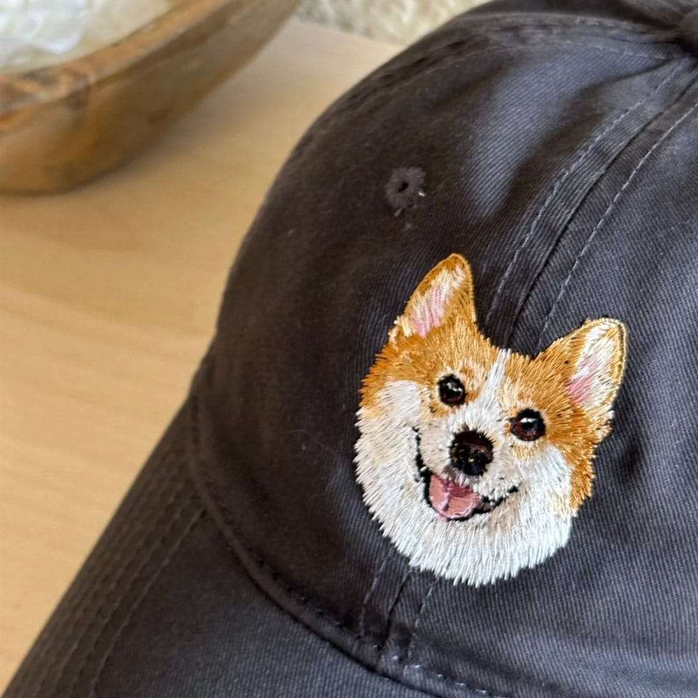 A custom embroidered hat featuring a detailed pet portrait.