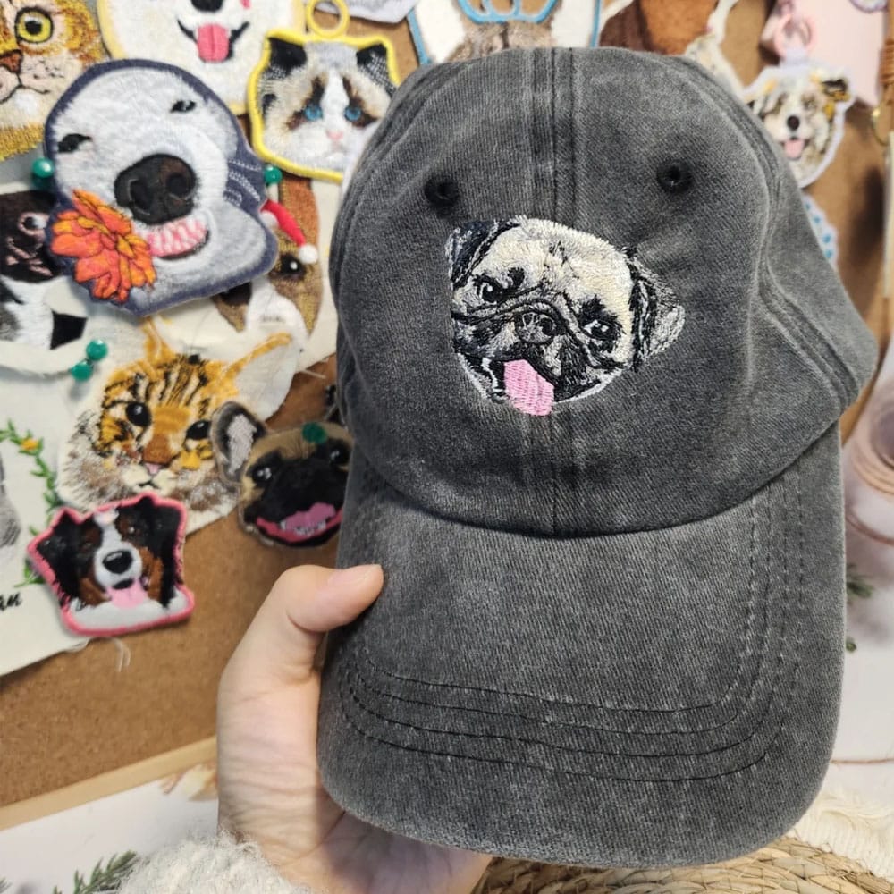A custom embroidered hat featuring a detailed pet portrait.