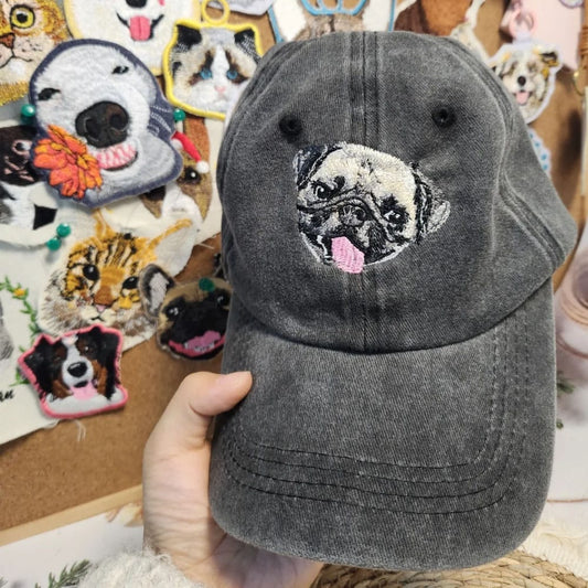 A custom embroidered hat featuring a detailed pet portrait.
