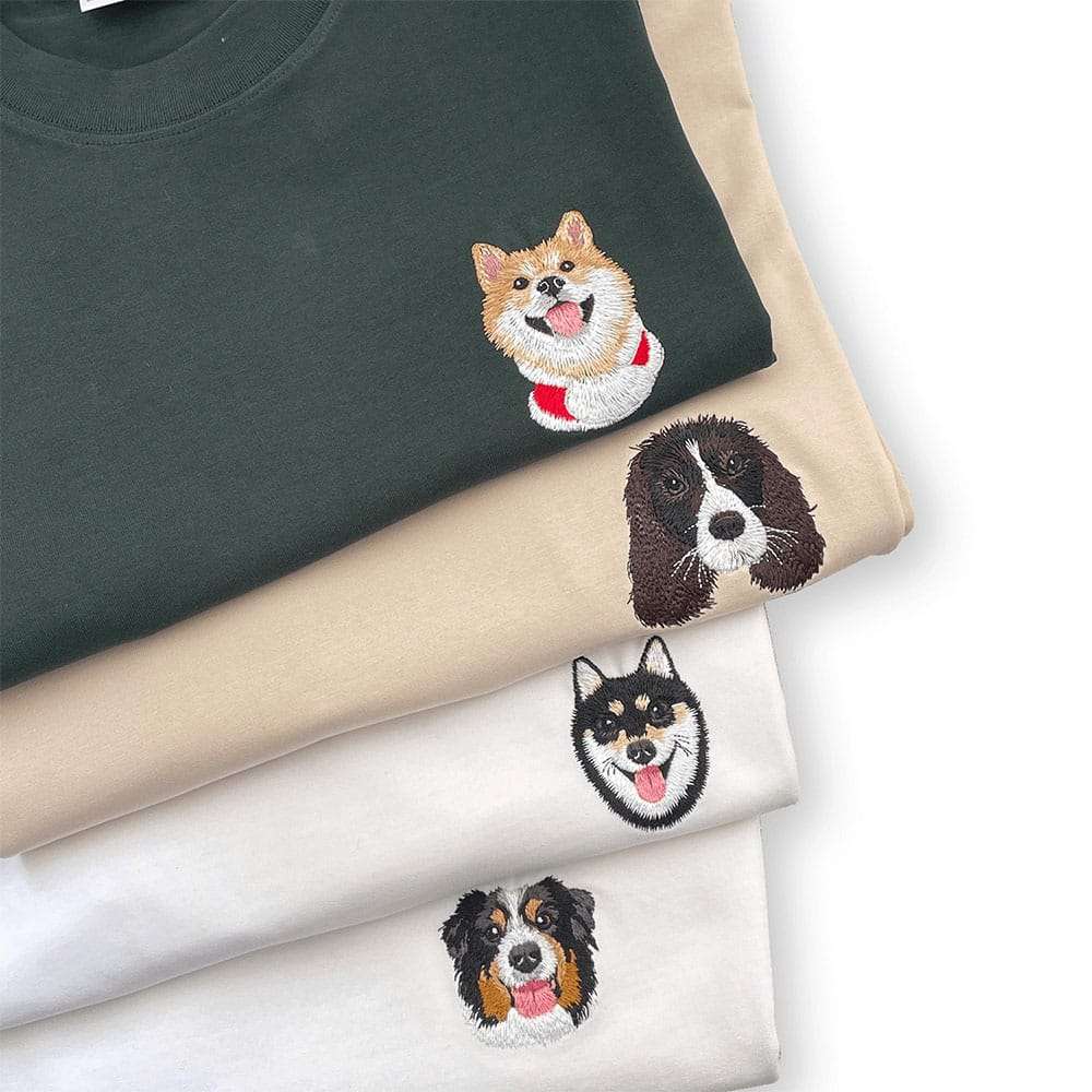 A custom t-shirt featuring a detailed embroidered pet portrait.