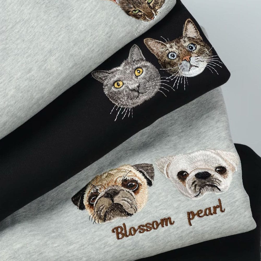 A collection of custom embroidered pet portrait sweatshirts.
