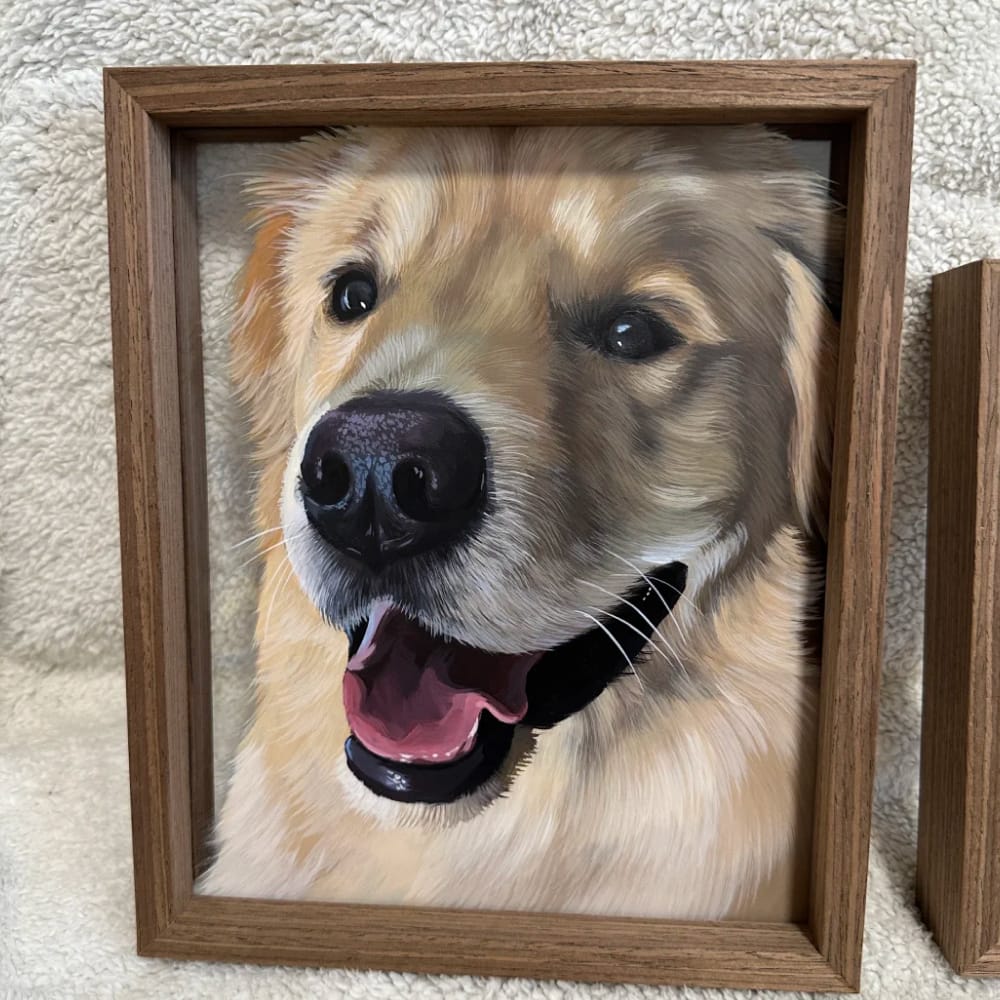 A custom hand-painted dog portrait on glass, featuring a realistic painting of a smiling Golden Retriever.