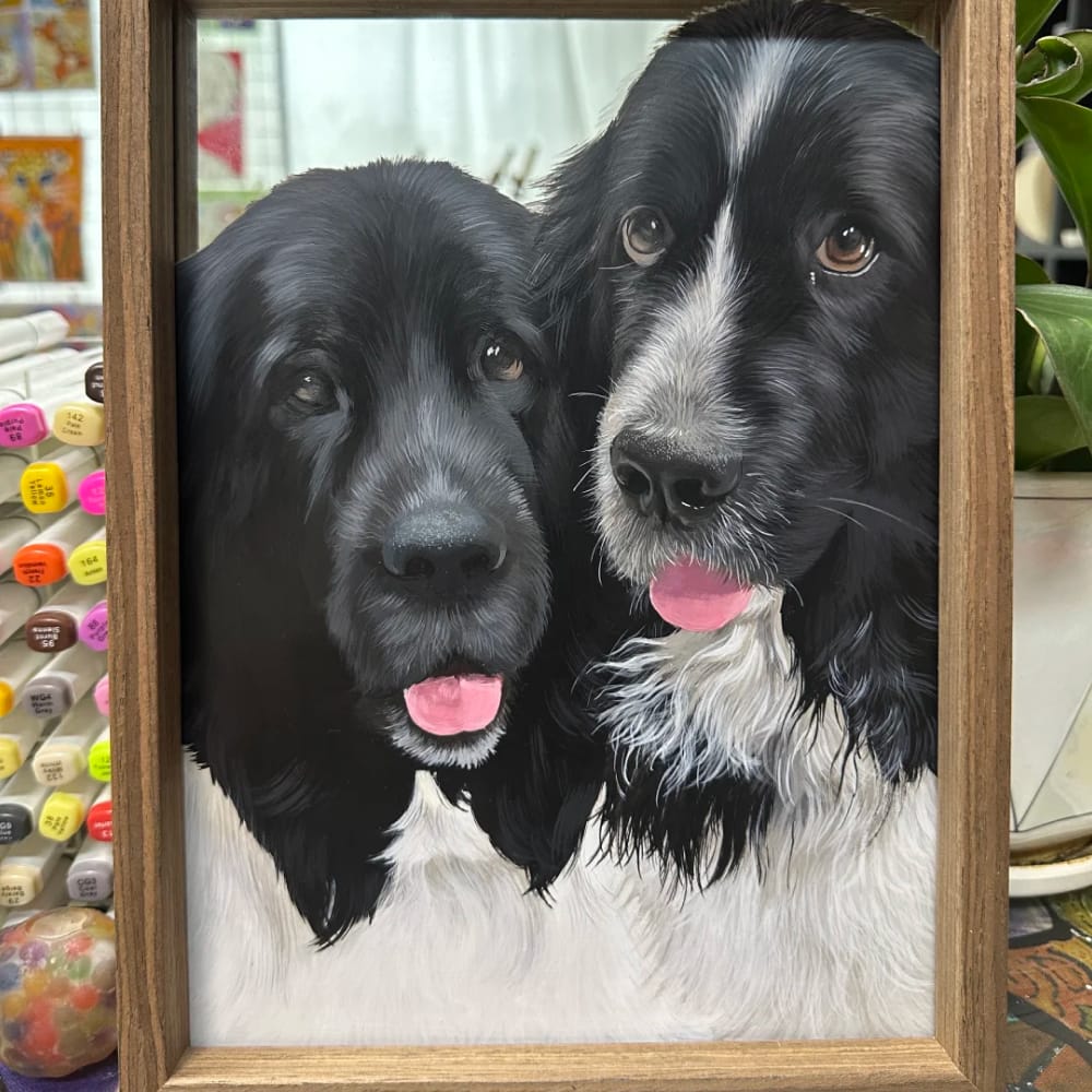 Custom hand-painted dog portrait on glass featuring two black and white dogs.