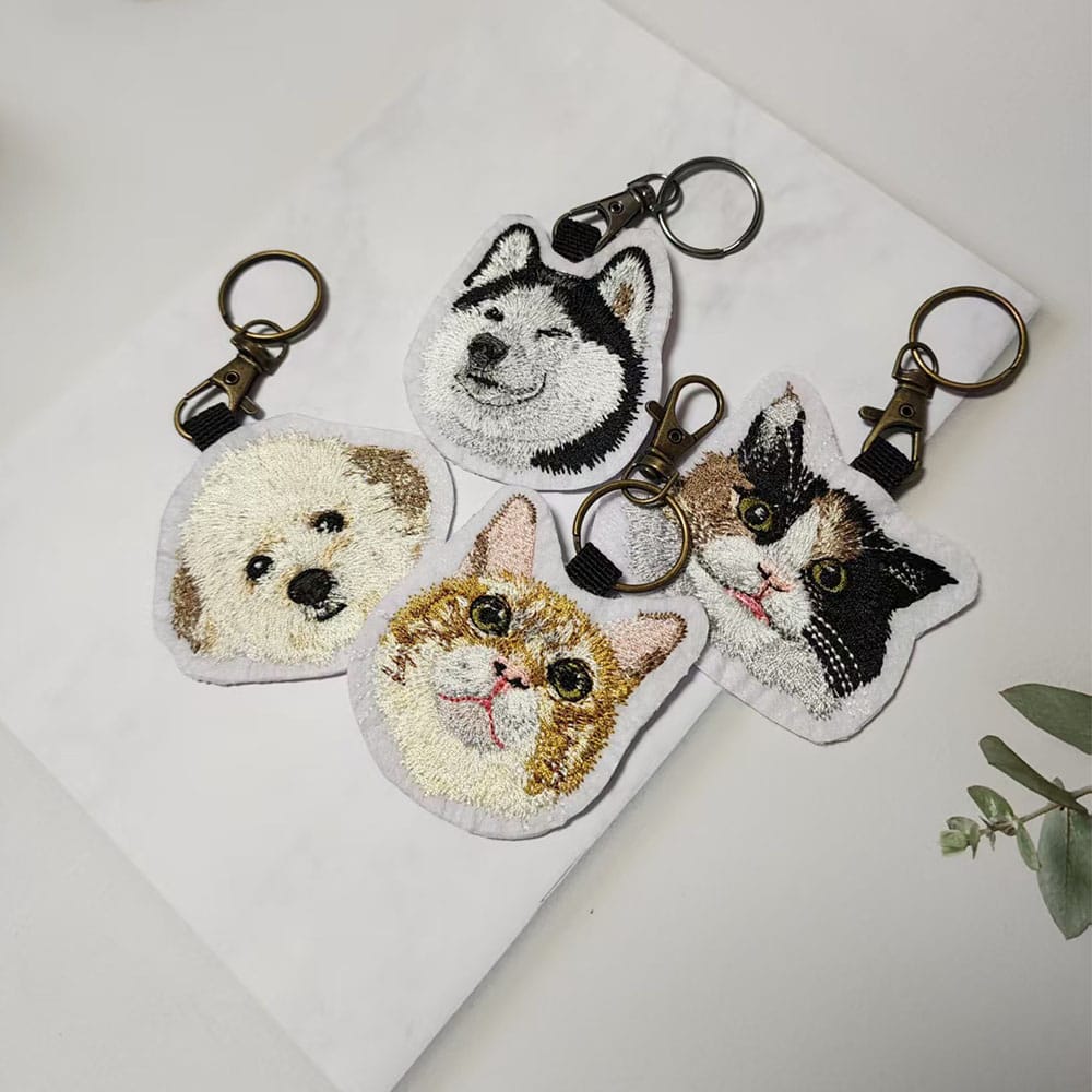 A collection of custom pet embroidery keychains, a perfect gift for animal lovers.