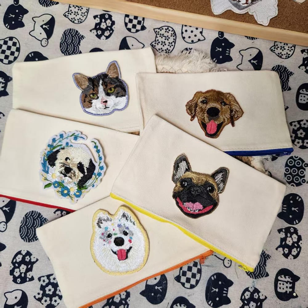 A custom pet embroidery keychain featuring a detailed pet portrait.