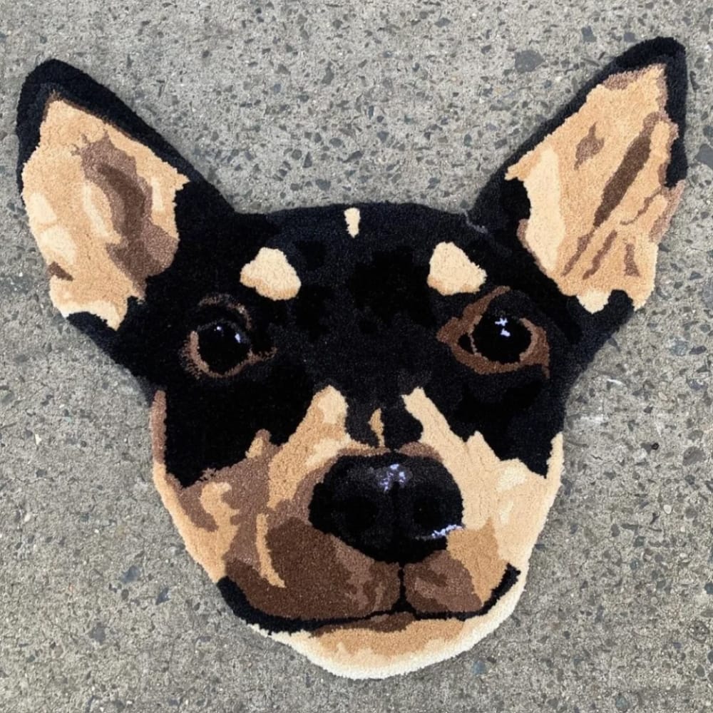 A handmade custom tufted rug designed to look like a pet's portrait.
