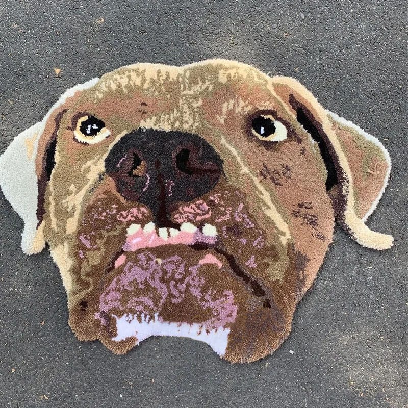 A handmade custom tufted rug designed to look like a pet's portrait.