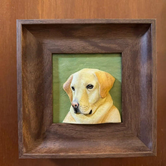 Custom pet portrait wood carving of a yellow Labrador's side profile, set in a dark wood frame.