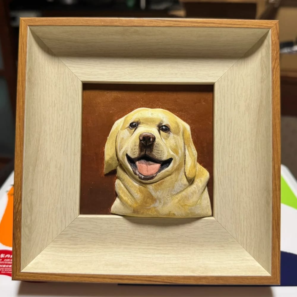 A custom pet portrait wood carving of a smiling yellow Labrador, set in a light wood frame.