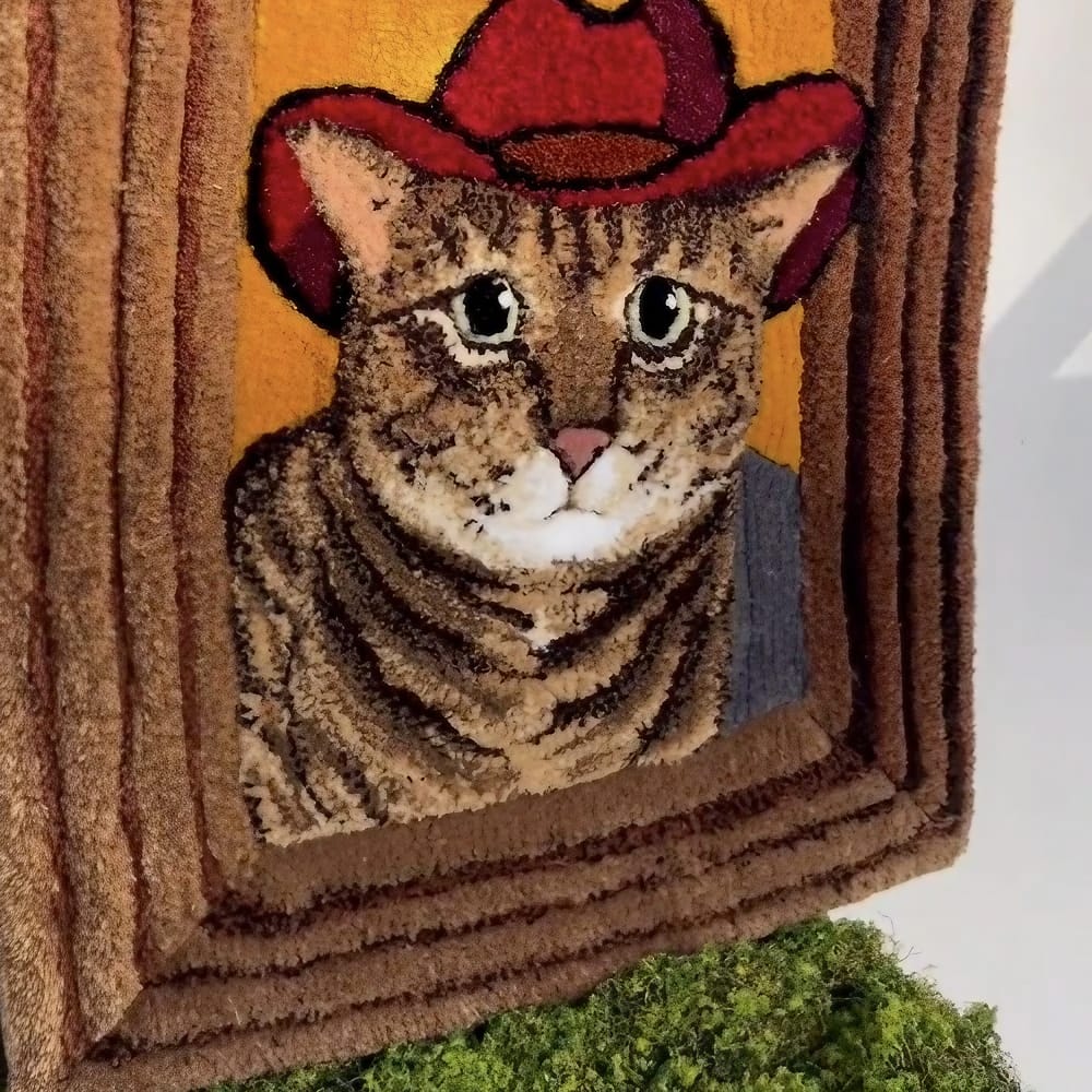 A handmade custom tufted pet tapestry featuring a detailed portrait of a pet.
