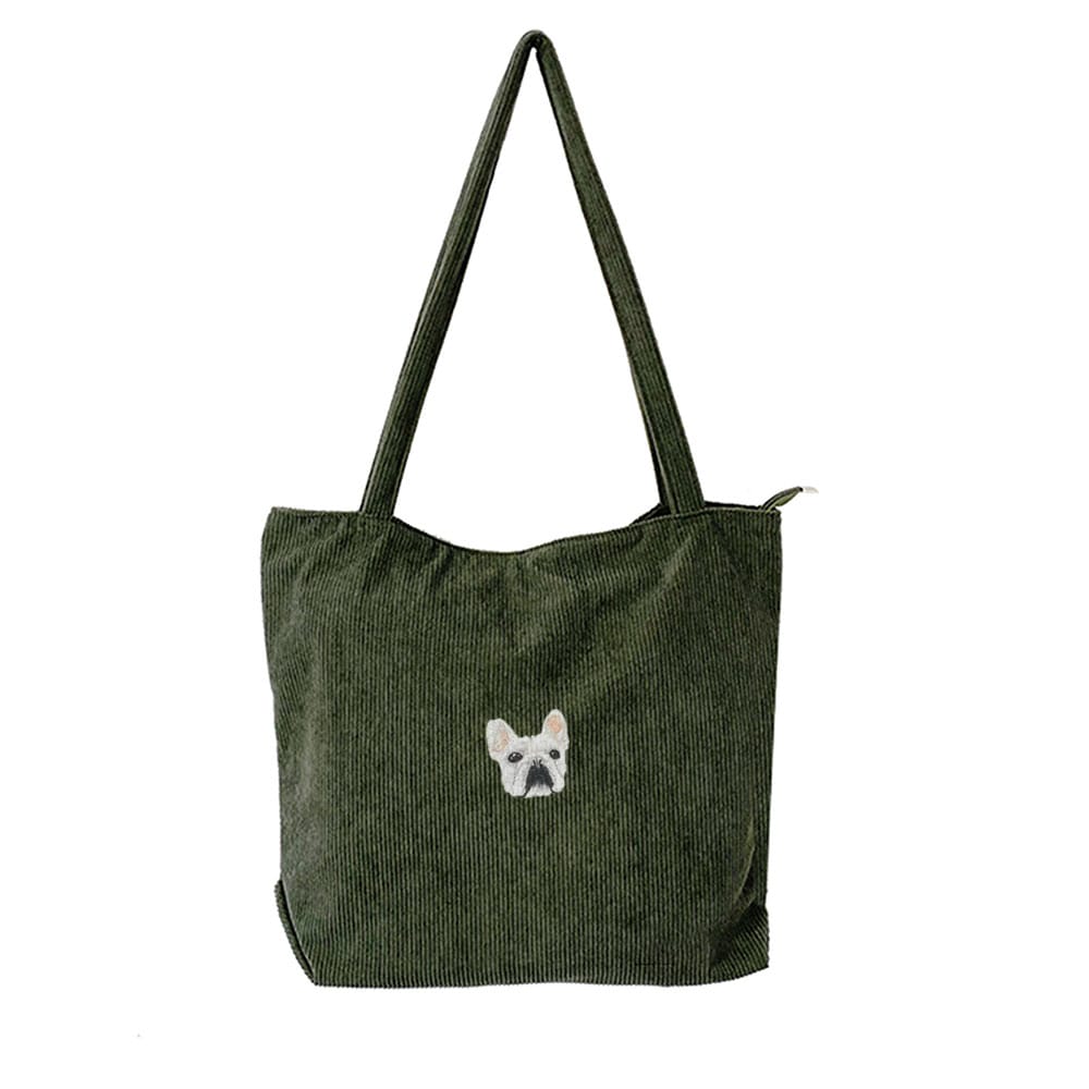A green corduroy bag featuring a custom embroidered pet portrait.