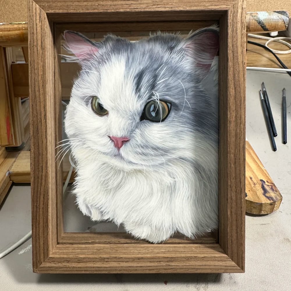 A personalized pet portrait on single-layer glass, hand-painted with a realistic fluffy grey and white cat.